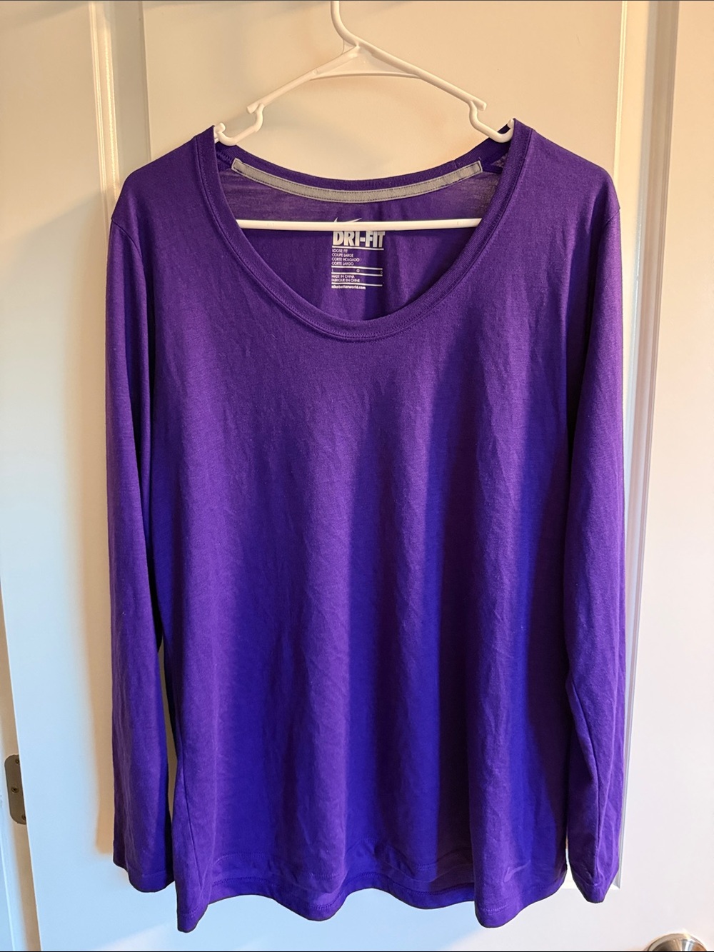 Nike Women's Long Sleeve Dri-FIT Loose Fit Tee in Purple